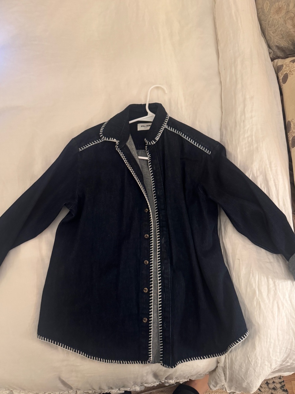 Dark wash still here denim jacket with white stitching